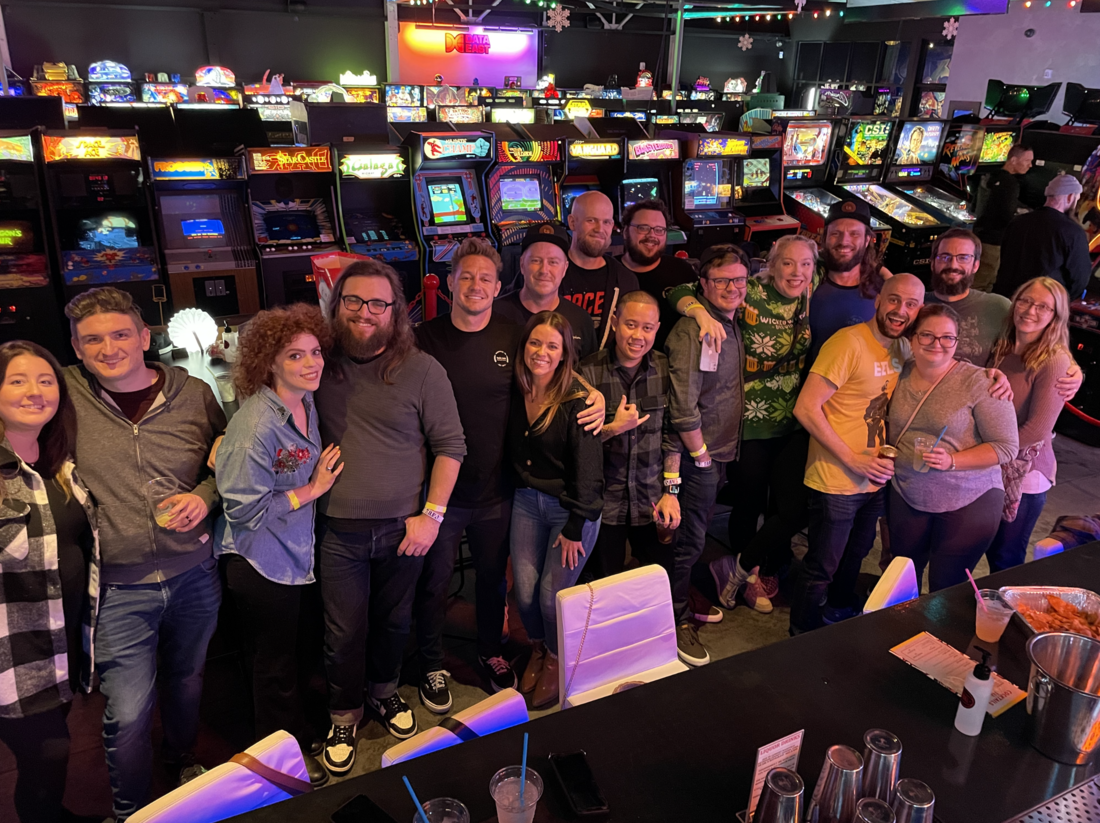Photo of the Twin Sun team at their 2022 holiday party at an arcade