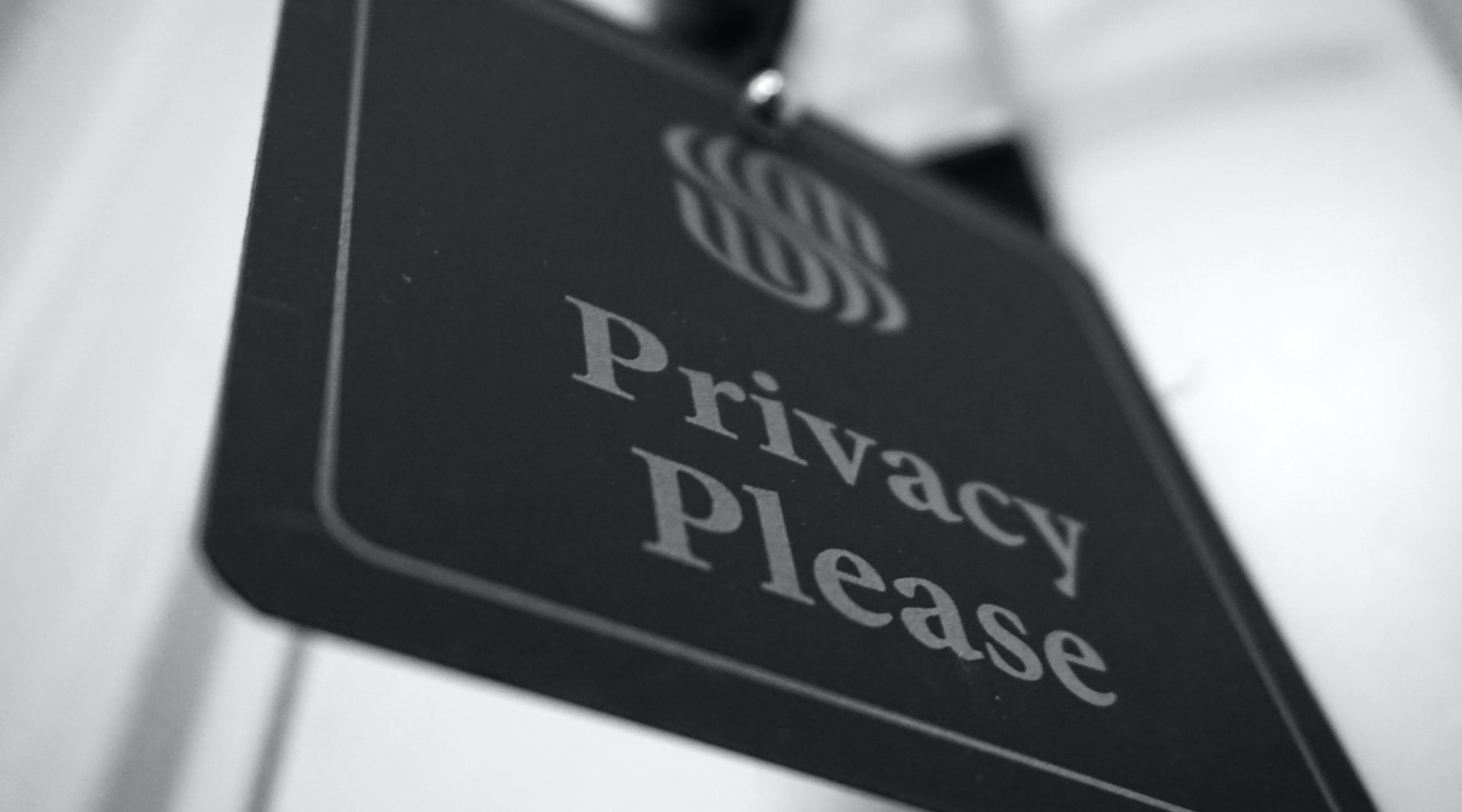 Closeup of a sign that reads 'Privacy Please'