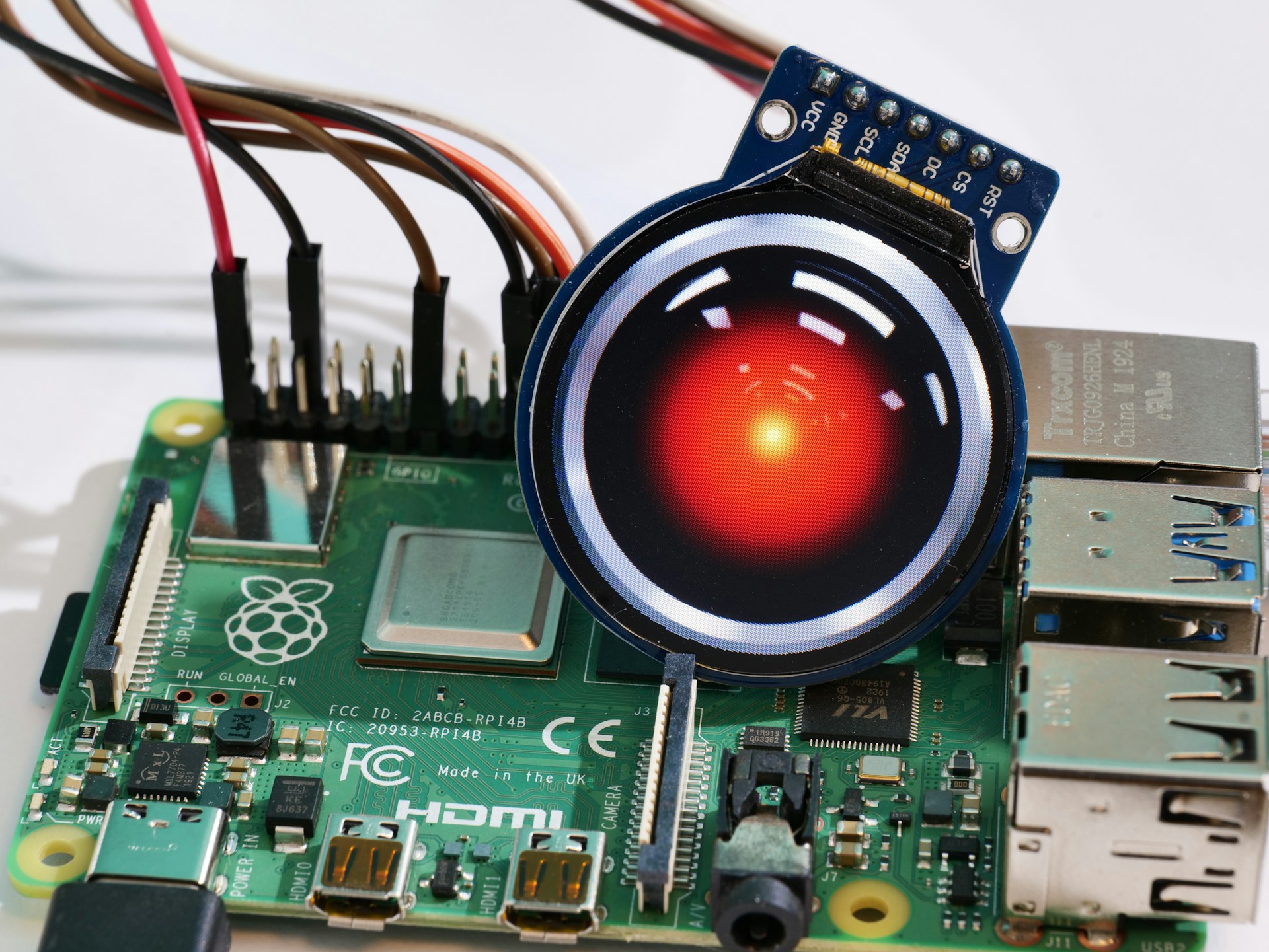 HAL 9000's iconic eye photoshopped on top of a Raspberry Pi board