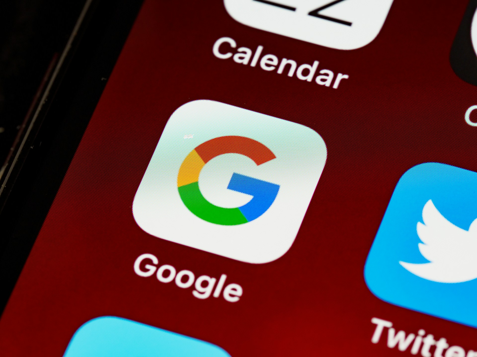 Closeup of a Google app icon displayed on a mobile phone screen