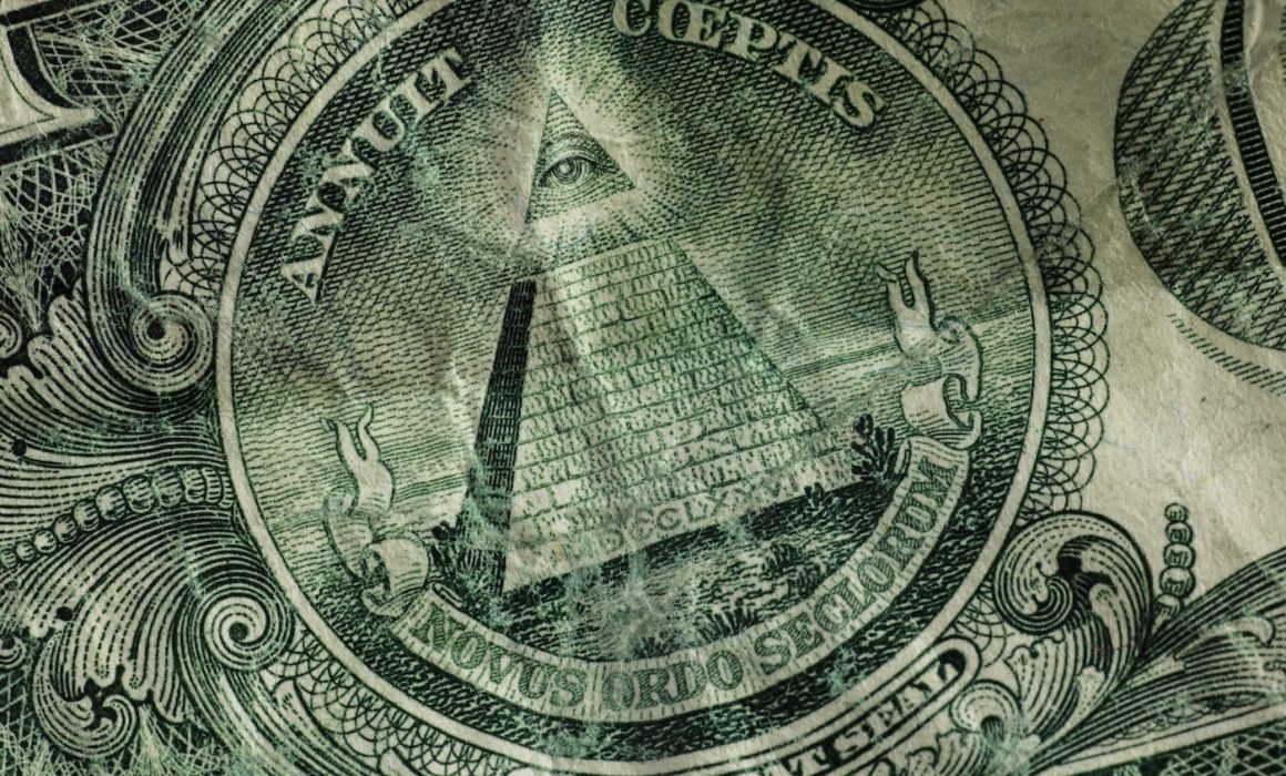 Closeup of a pyramid on the back of a United States dollar bill